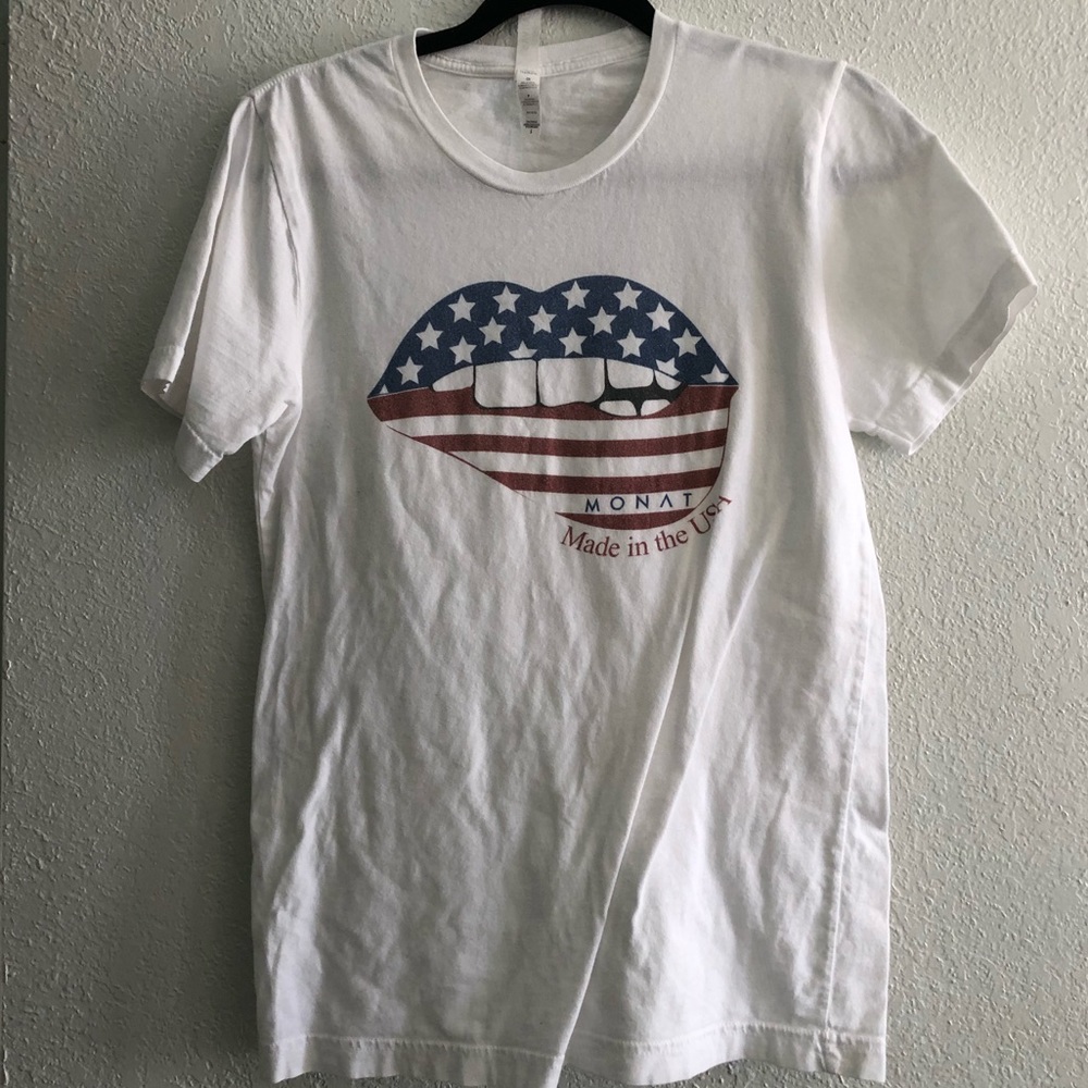 Monat top size s has biting lips with the flag on it and says Monat made in USA